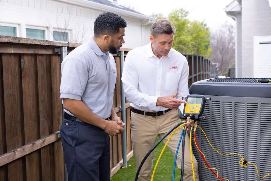 Purified Air technicians servicing an HVAC system